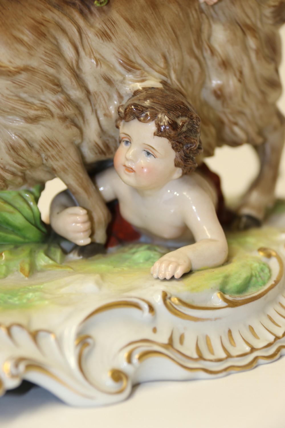 A fine Porcelain Figure Group of three Putti Wrestling with a Goat by Hochst Factory View XV