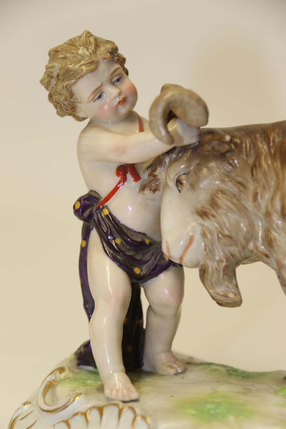 A fine Porcelain Figure Group of three Putti Wrestling with a Goat by Hochst Factory View XVI