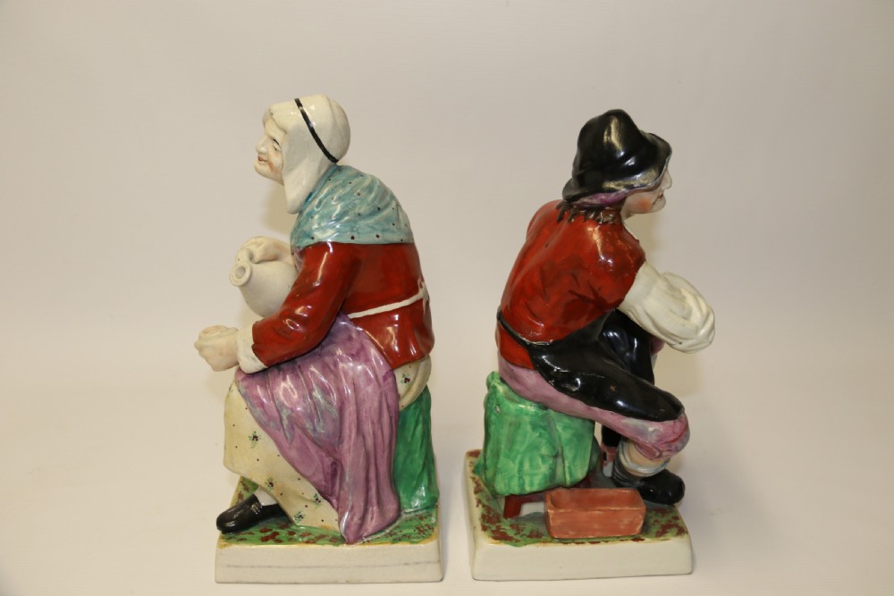 A large pair of  19th C Staffordshire Pottery Seated figures. View II