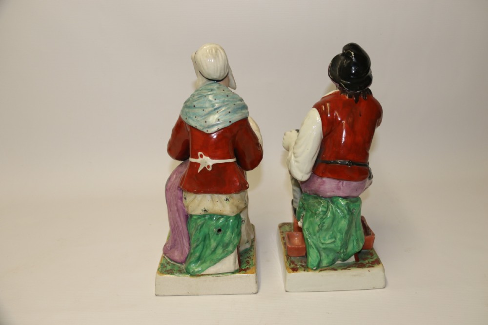 A large pair of  19th C Staffordshire Pottery Seated figures. View III