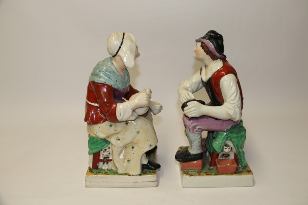 A large pair of  19th C Staffordshire Pottery Seated figures. View IV