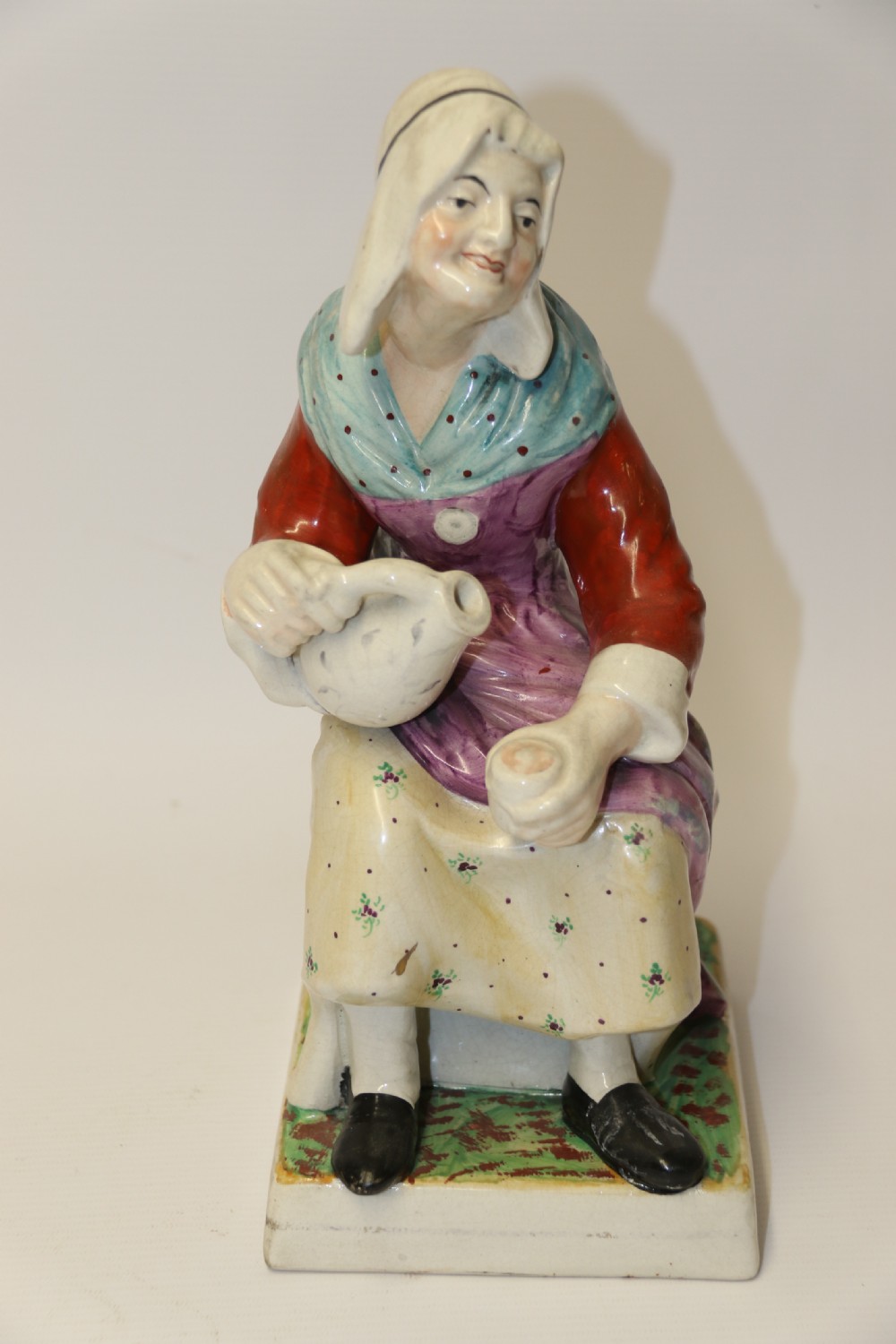 A large pair of  19th C Staffordshire Pottery Seated figures. View V