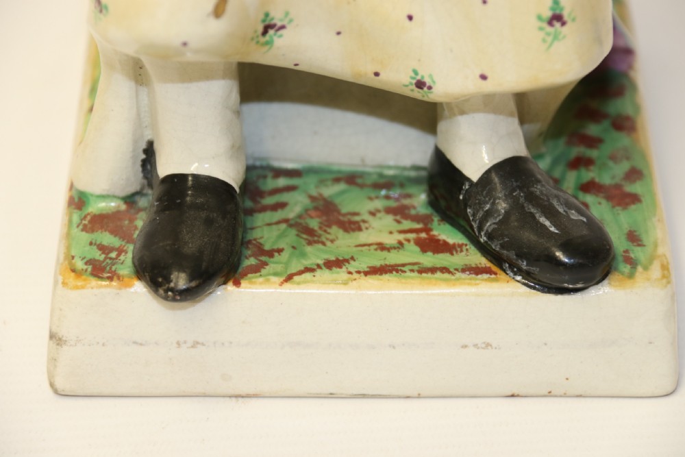 A large pair of  19th C Staffordshire Pottery Seated figures. View X