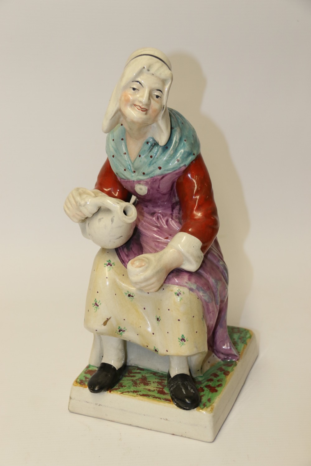 A large pair of  19th C Staffordshire Pottery Seated figures. View XI