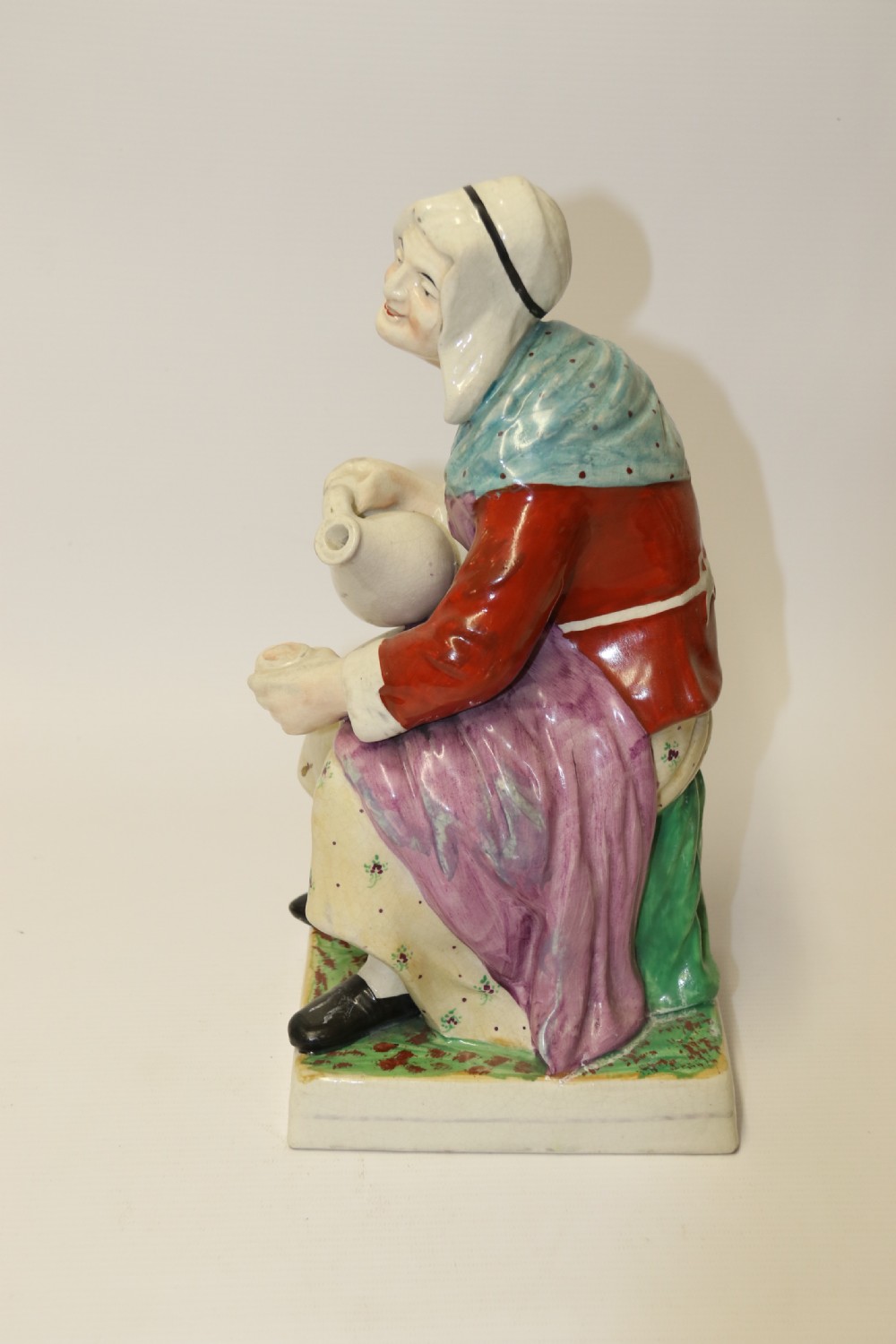 A large pair of  19th C Staffordshire Pottery Seated figures. View XII