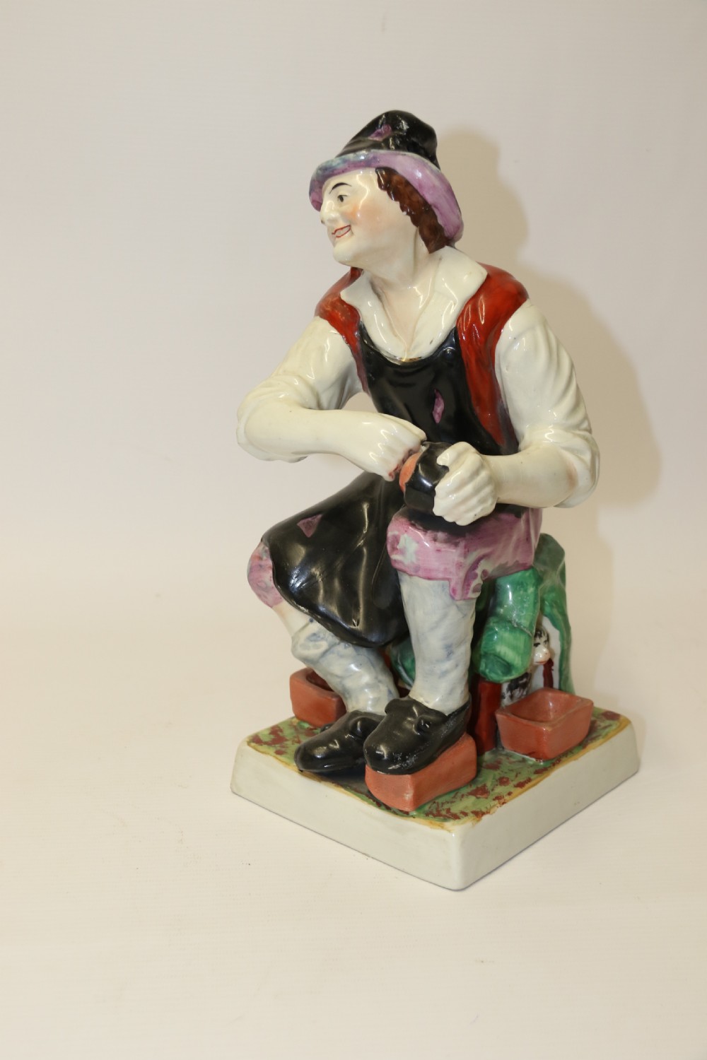 A large pair of  19th C Staffordshire Pottery Seated figures. View XVIII