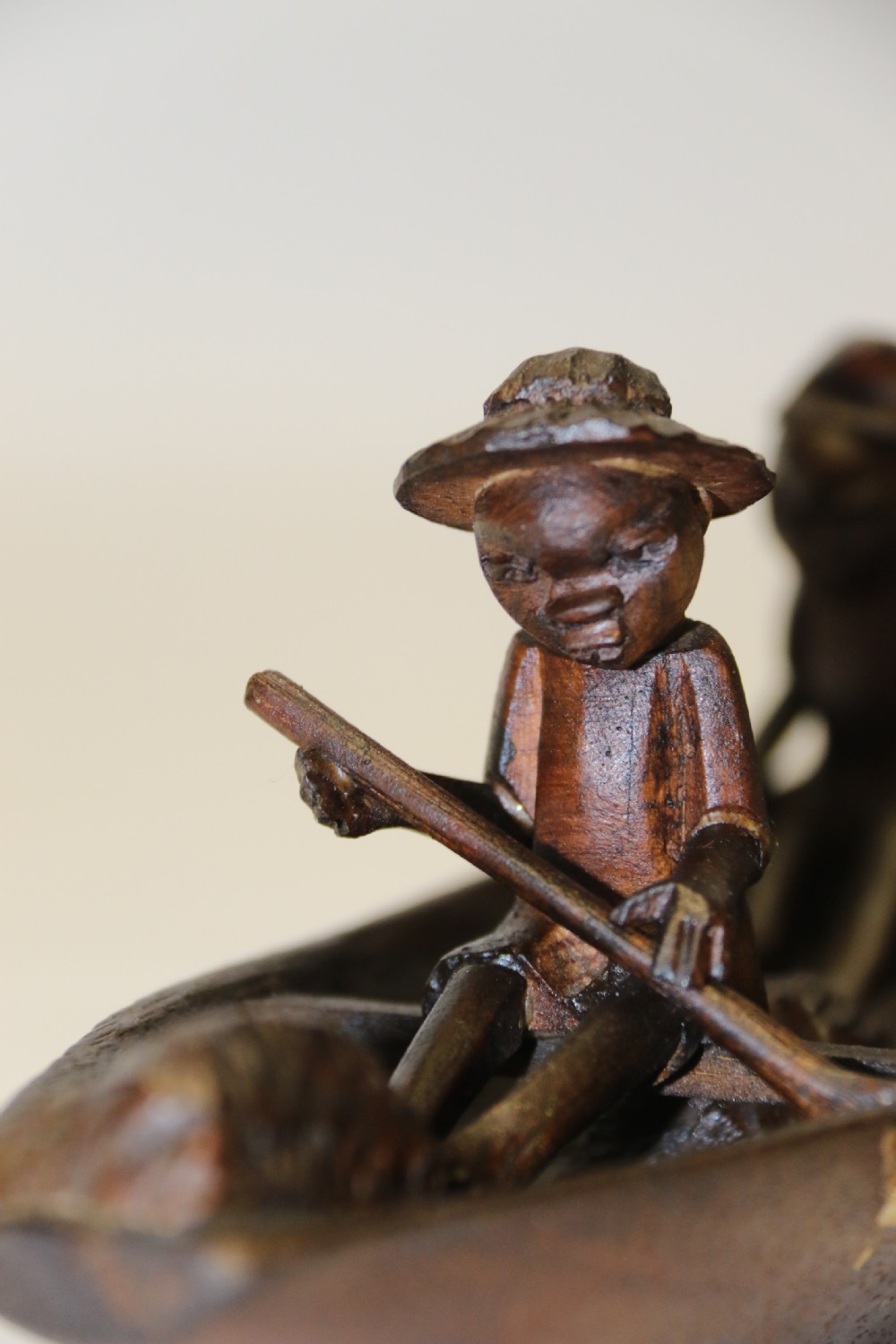 An African Carved Wooden model of a dug-out canoe with 18 seated tribal figures. View IV