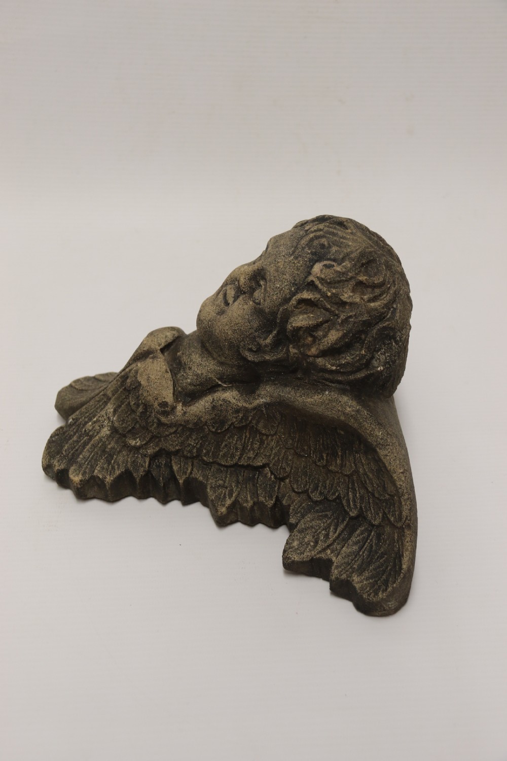 A hand carved Portland Stone Wall Cherub, signed M. R Bland,1874 View V