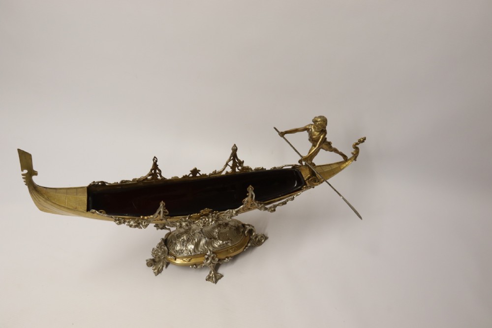 A fine silver and gilt bronze table centre piece in the form of a gondola  View III