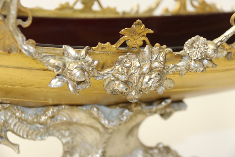 A fine silver and gilt bronze table centre piece in the form of a gondola  View V