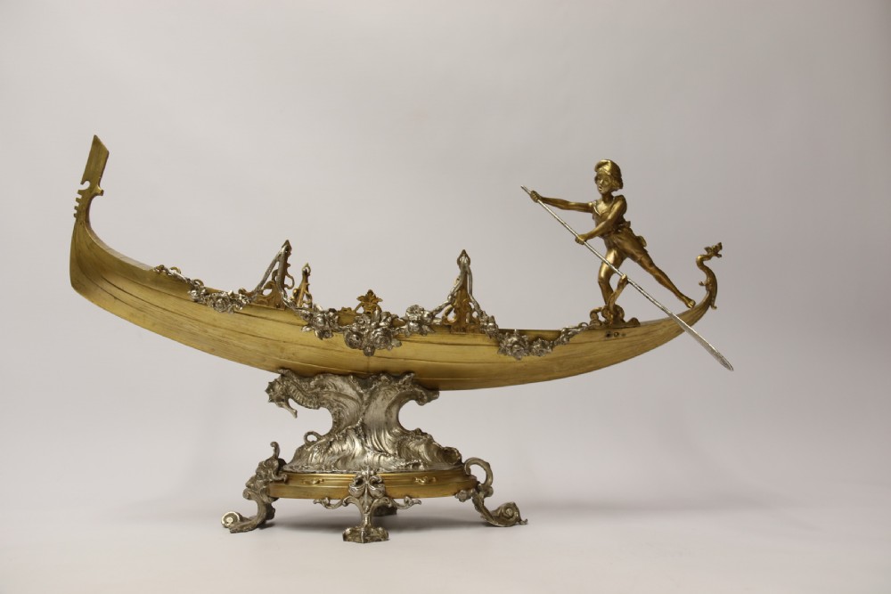 A fine silver and gilt bronze table centre piece in the form of a gondola  View XXII