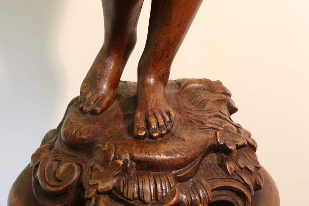Antique 19 C Carved study of Semi nude Mythical Boy standing on a fluted pedestal   View V