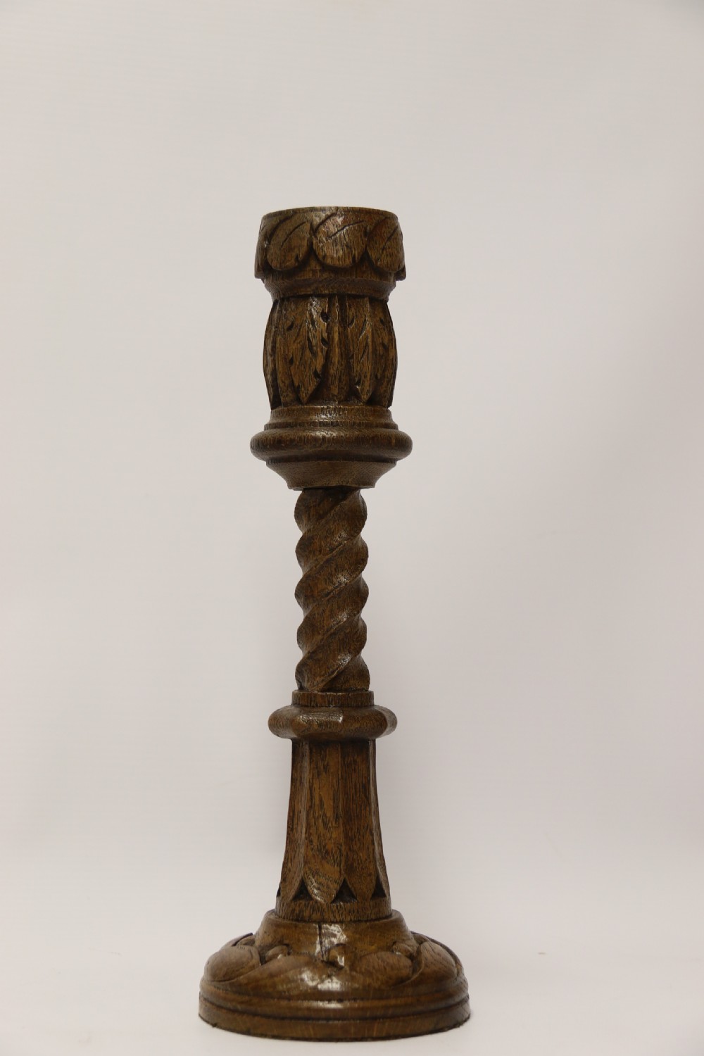 A fine pair of English Victorian Carved Oak Gothic Revival Candlesticks. View II