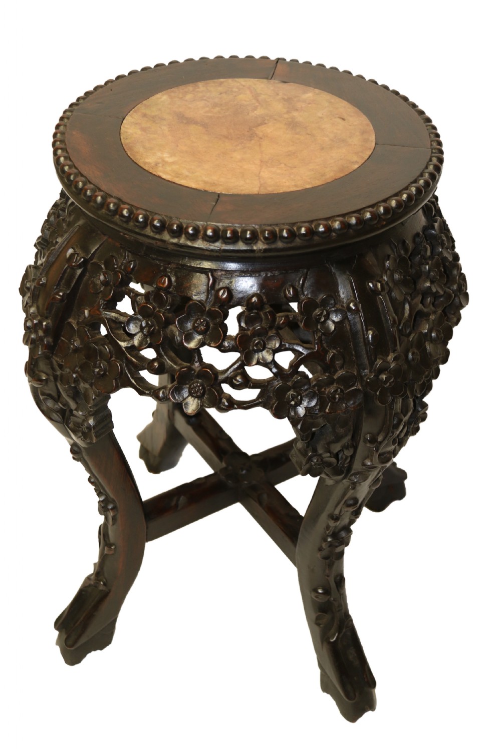 A Chinese late 19th century carved hardwood circular table or stand