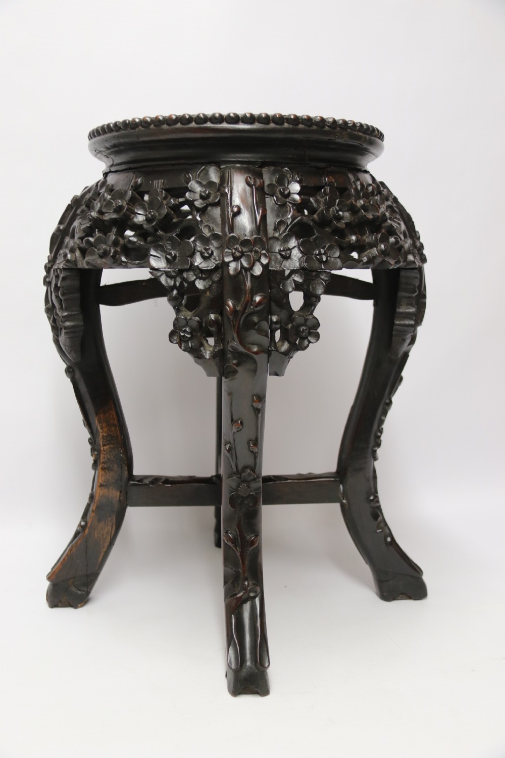 A Chinese late 19th century carved hardwood circular table or stand View II