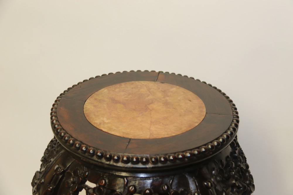 A Chinese late 19th century carved hardwood circular table or stand View III