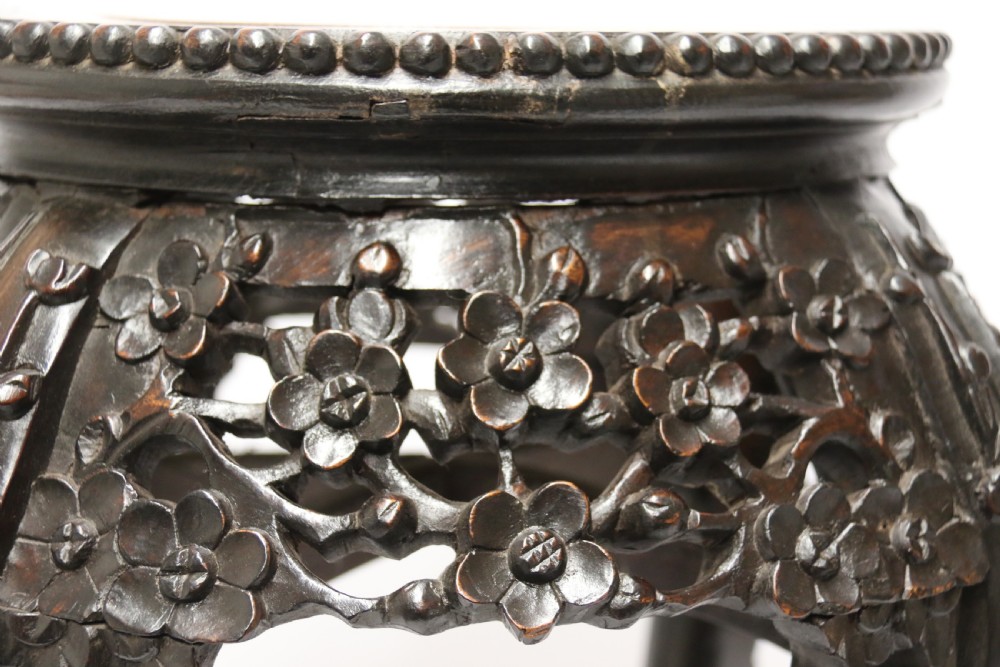 A Chinese late 19th century carved hardwood circular table or stand View IX