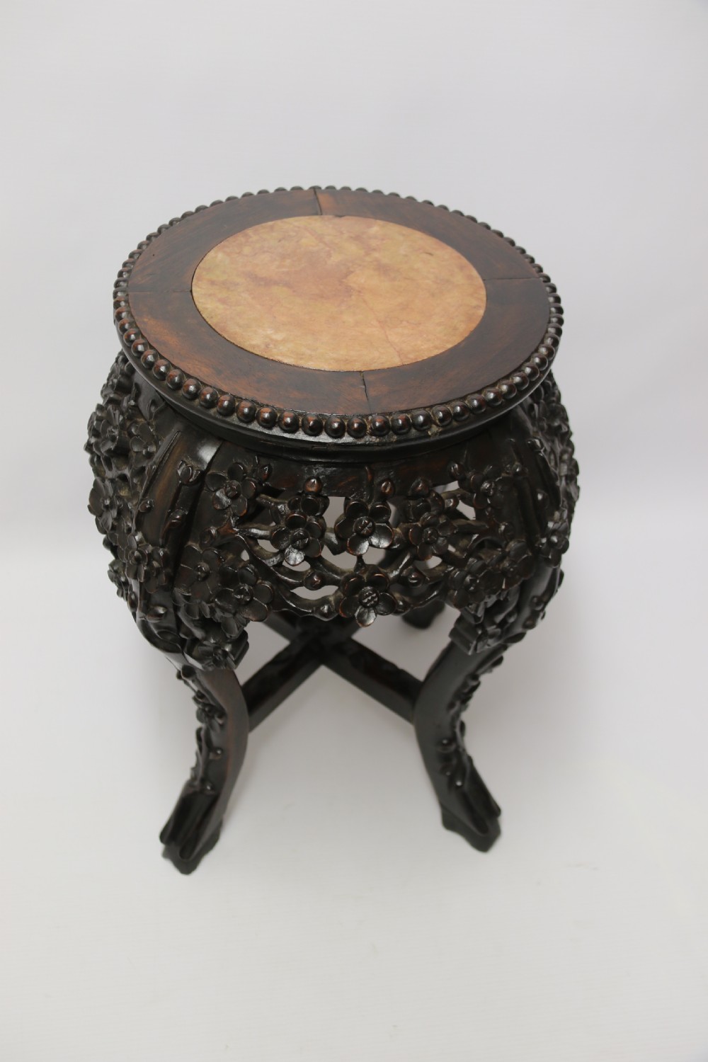 A Chinese late 19th century carved hardwood circular table or stand View XII