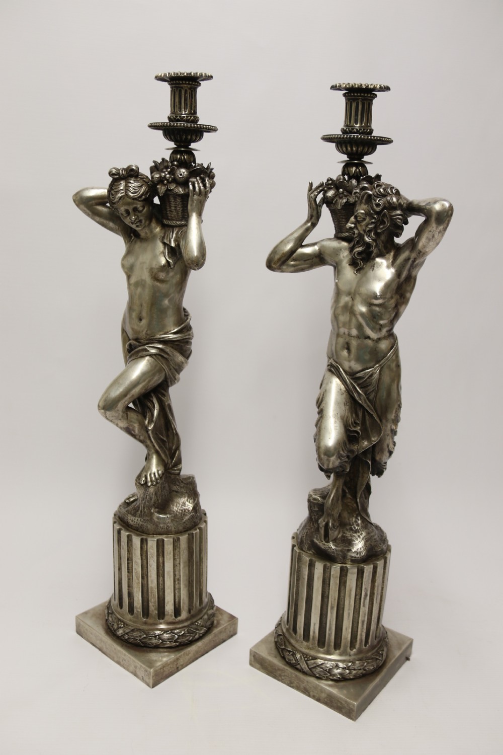 A Large pair of  19th c silvered bronze classical figurative candlesticks View II
