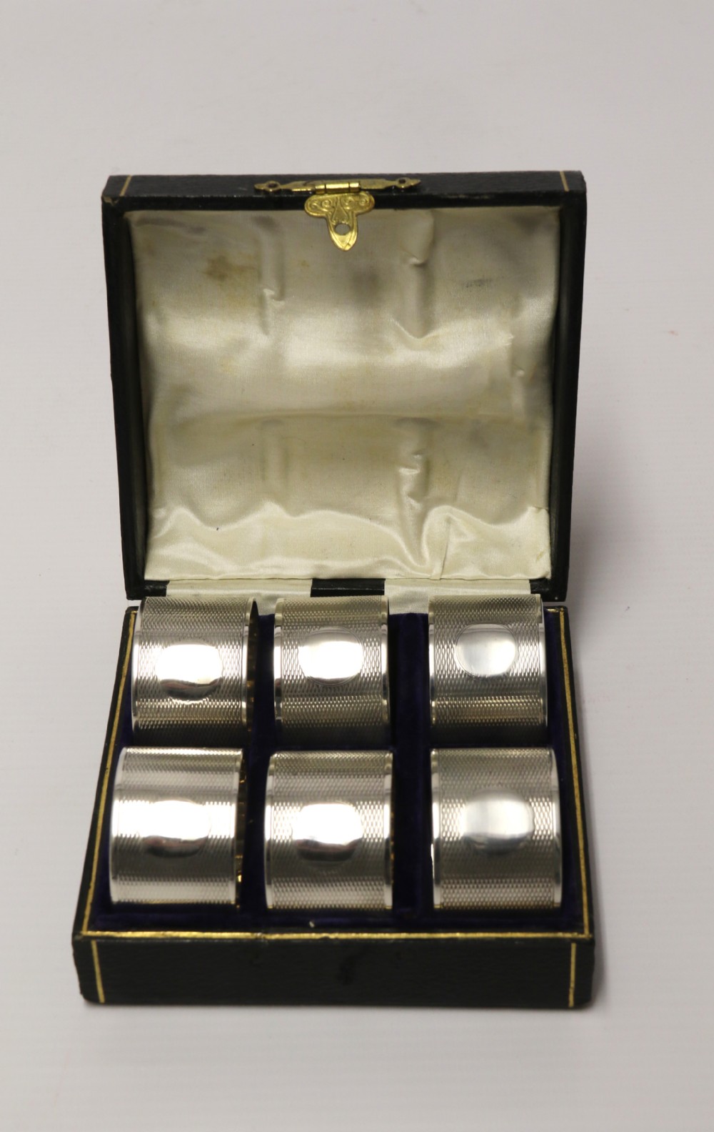 A boxed set of six Silver Napkin Rings, 1919 - 1920