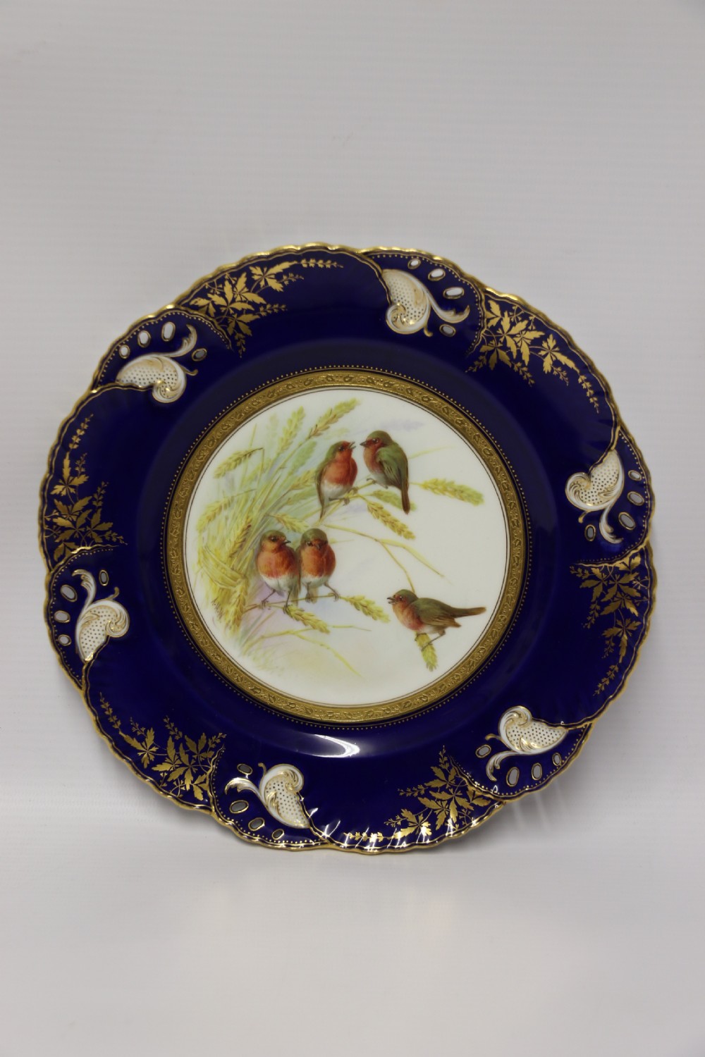 A charming Victorian Minton’s porcelain cabinet plate hand painted with Robins