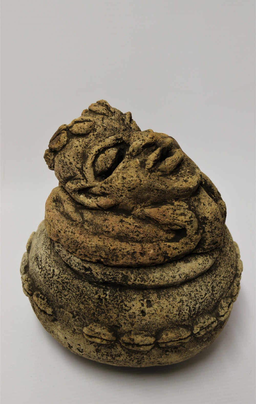 An ancient carved limestone Nomoli figurative pot from the Mende people of Sierra Leone