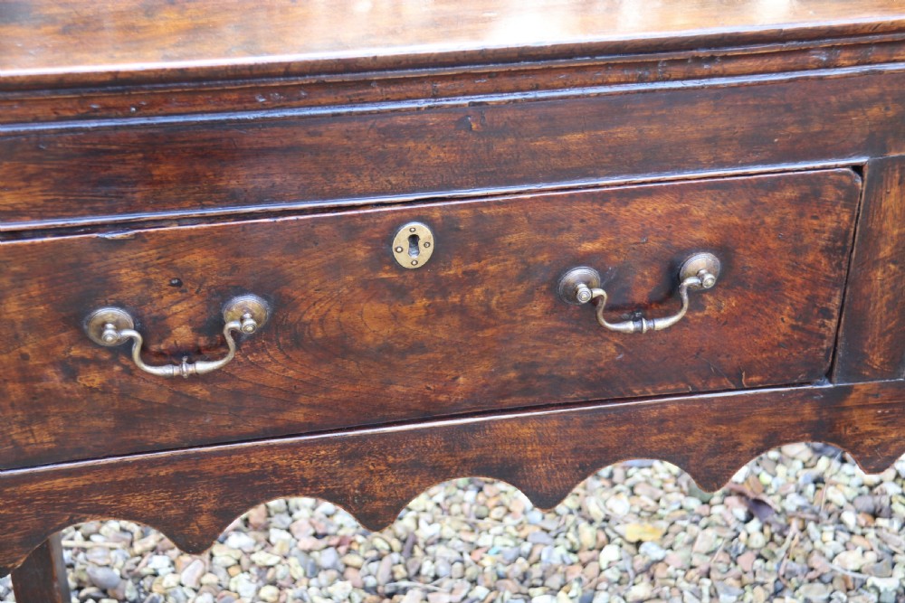 A good late 18th century three drawer oak dresser base   View II