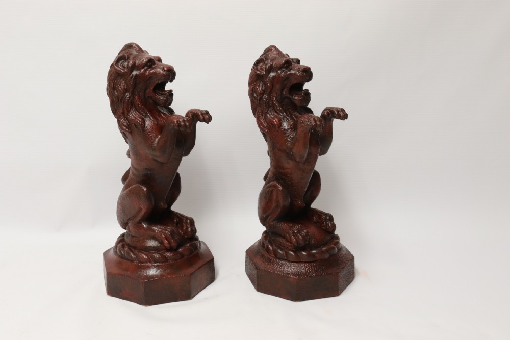 A pair of Regency period cast iron lion doorstops View VII