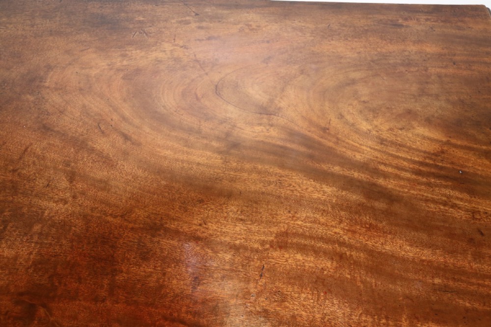 A Georgian serpentine fronted side table with writing and dressing fitment View VII