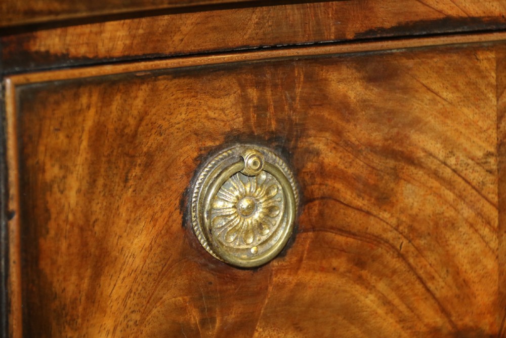 A Georgian serpentine fronted side table with writing and dressing fitment View XV