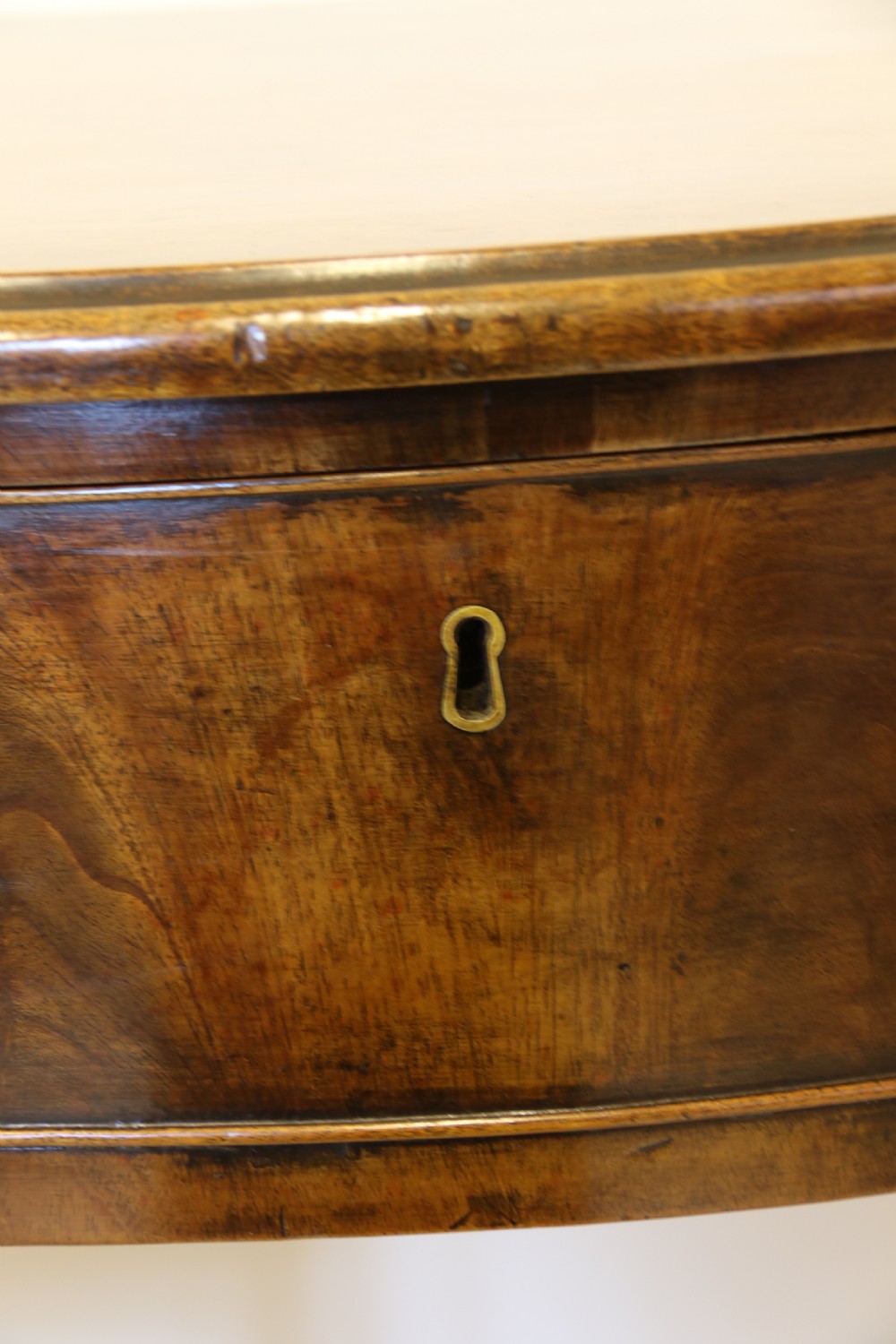 A Georgian serpentine fronted side table with writing and dressing fitment View XVII