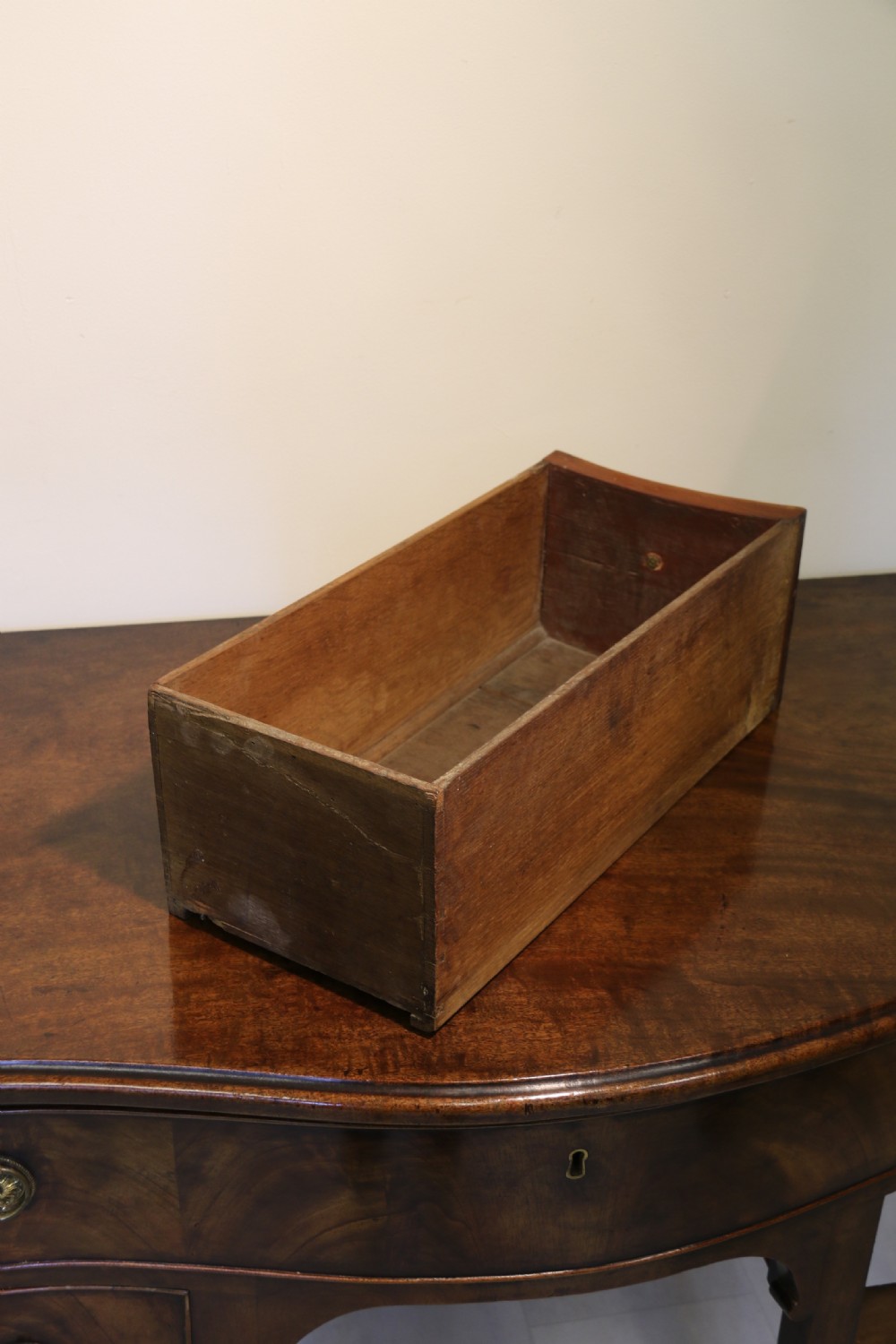 A Georgian serpentine fronted side table with writing and dressing fitment View XVIII
