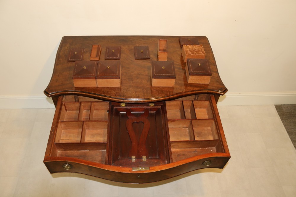 A Georgian serpentine fronted side table with writing and dressing fitment View XXIII