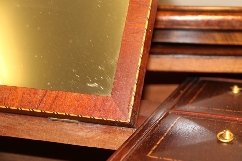A Georgian serpentine fronted side table with writing and dressing fitment View XXVII