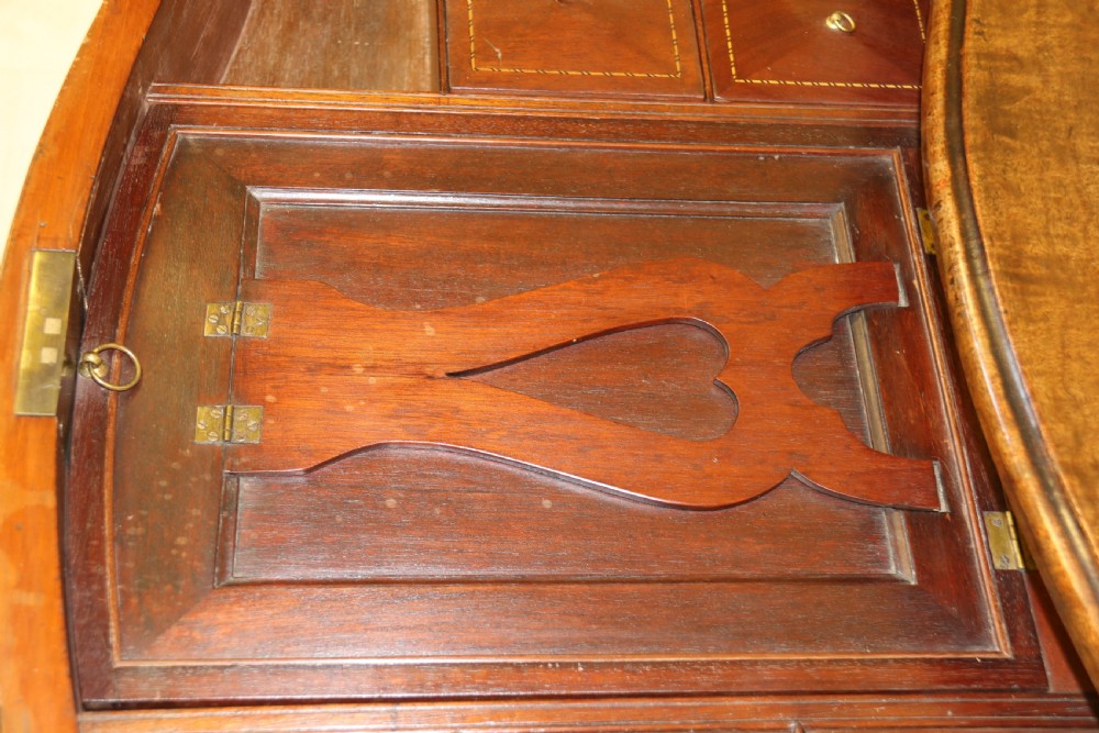 A Georgian serpentine fronted side table with writing and dressing fitment View XXX