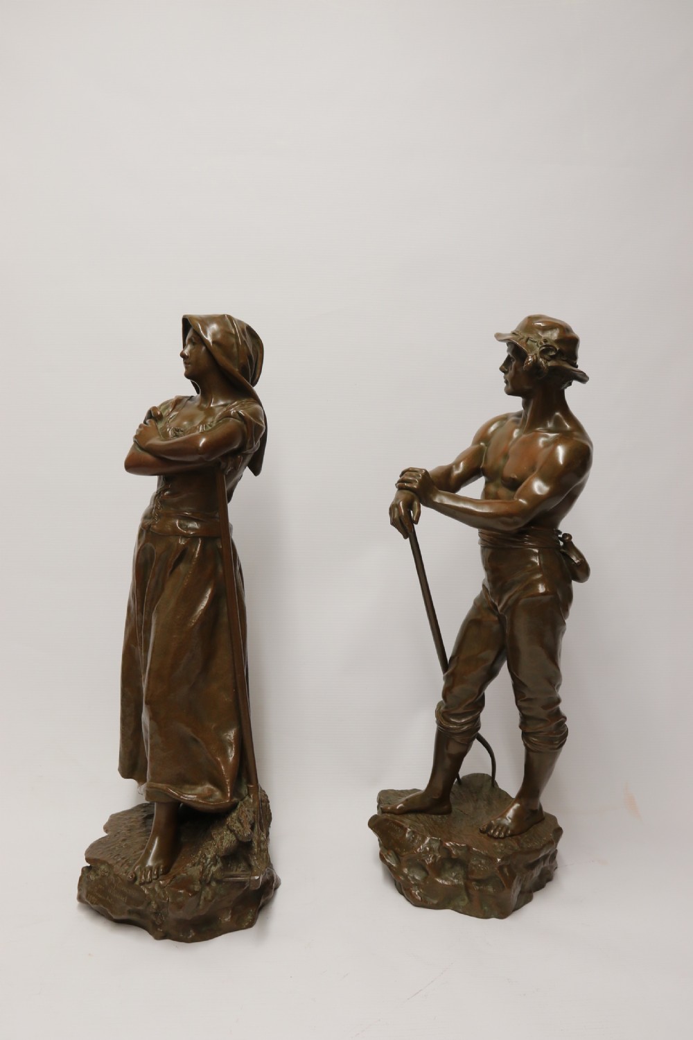 A beautiful pair of large bronze figures depicting farm workers View III