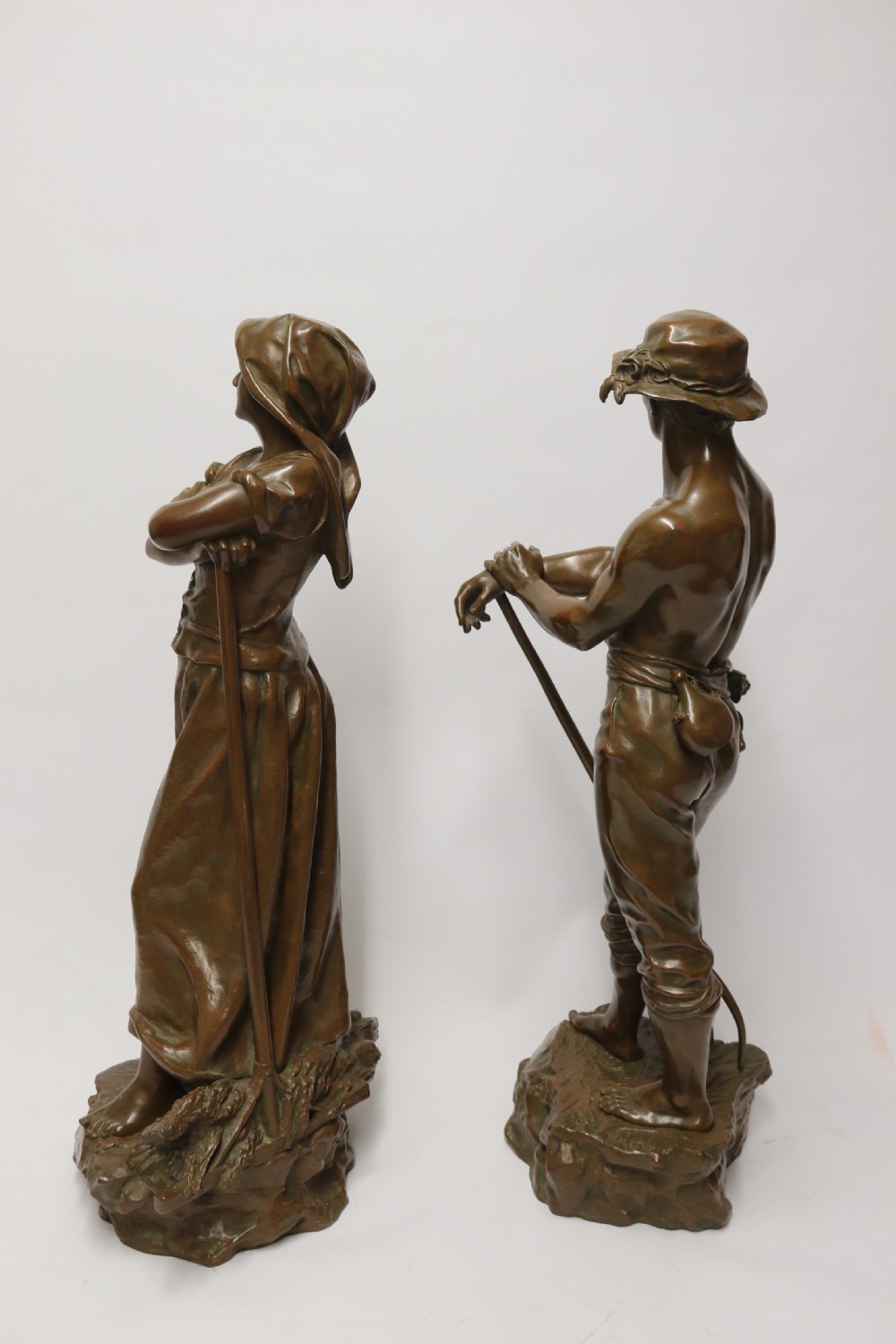 A beautiful pair of large bronze figures depicting farm workers View IV