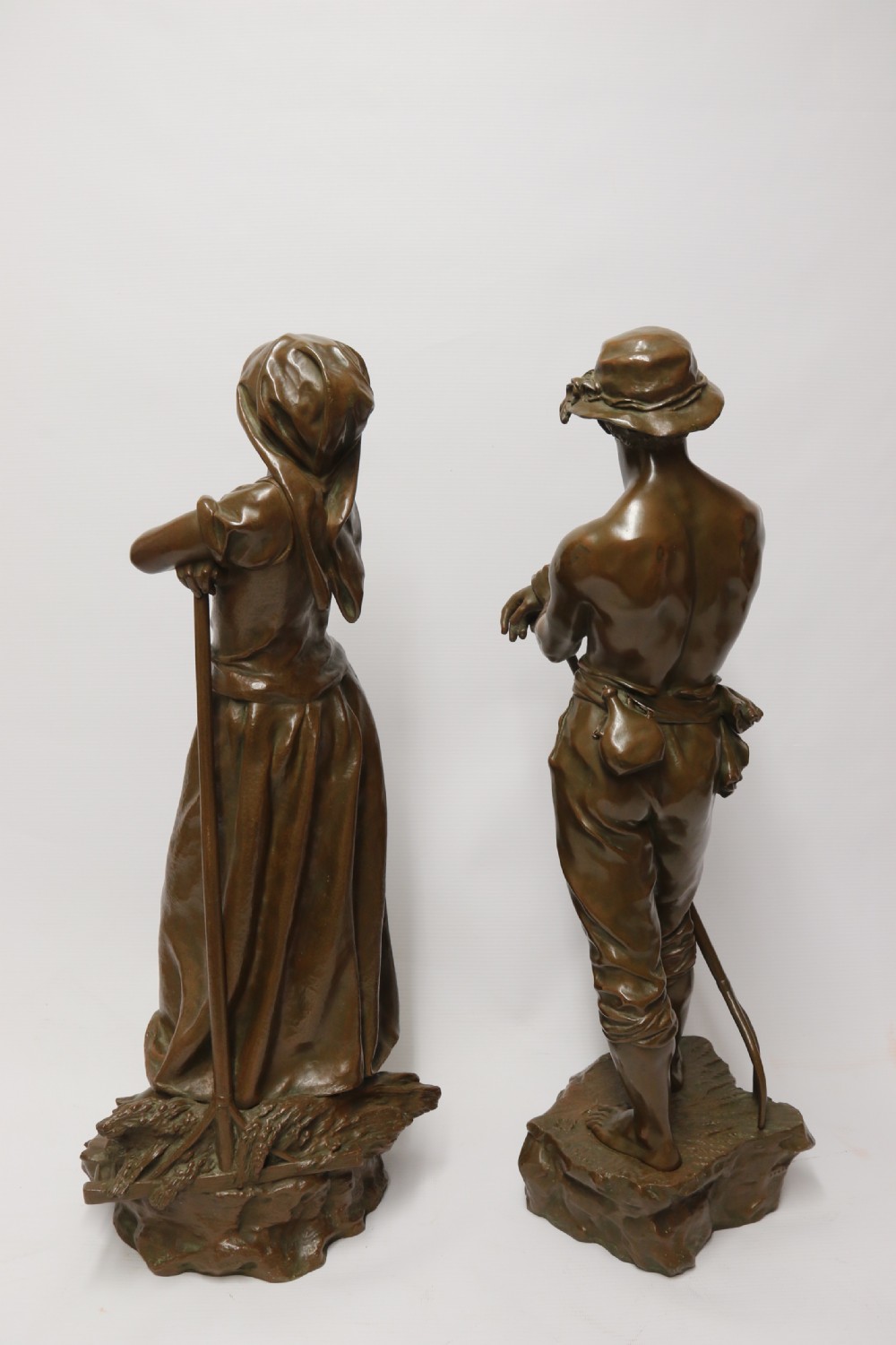 A beautiful pair of large bronze figures depicting farm workers View V