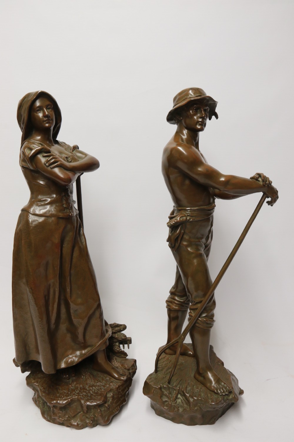 A beautiful pair of large bronze figures depicting farm workers View IX