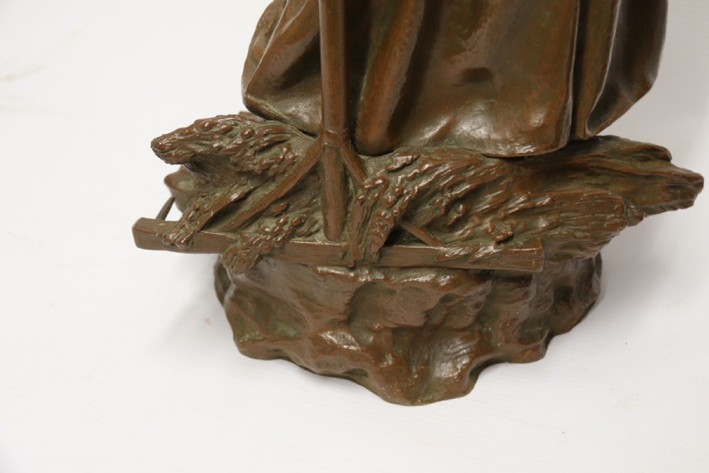 A beautiful pair of large bronze figures depicting farm workers View XV