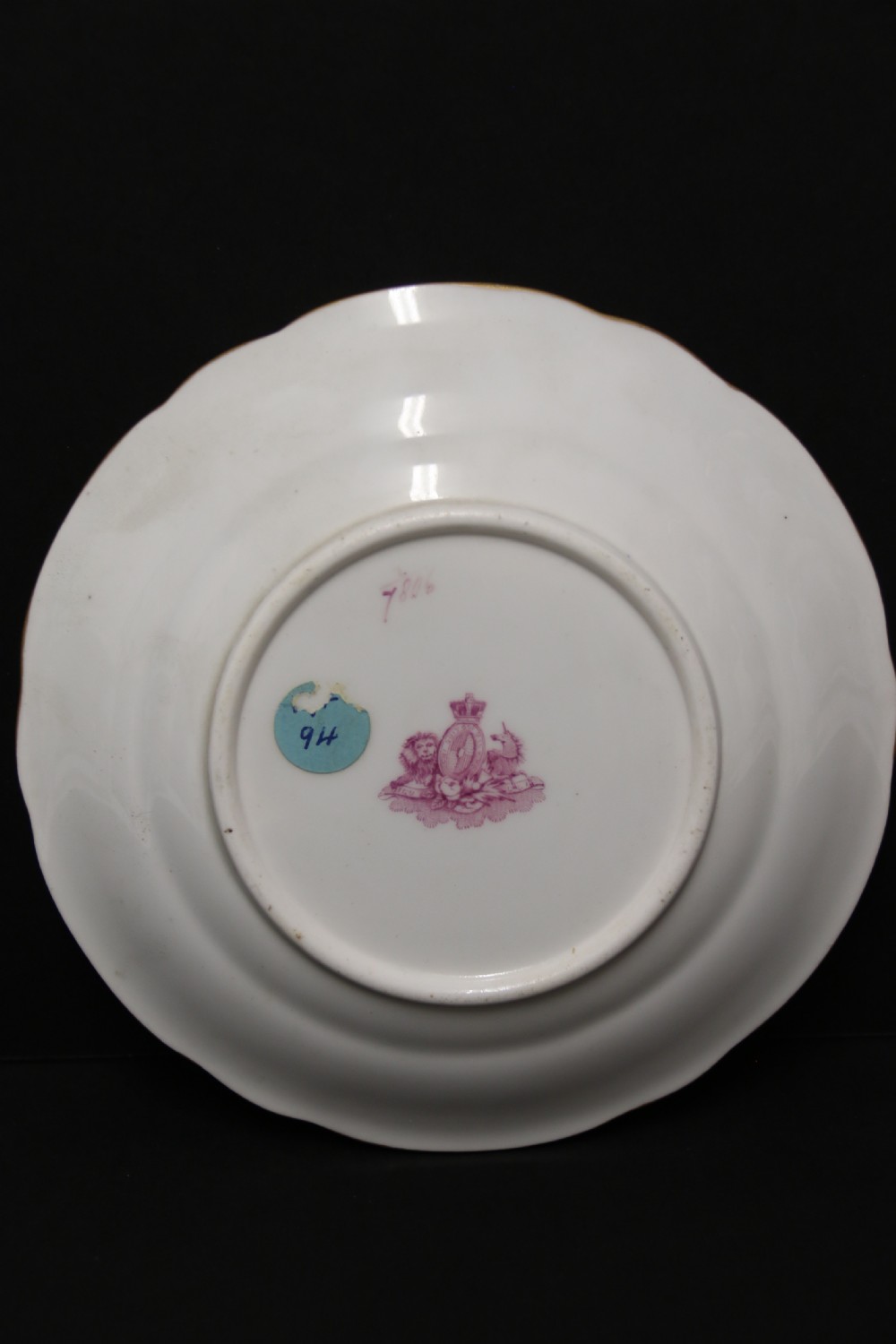 An early nineteenth-century Davenport porcelain cabinet trio comprising a teacup, coffee cup, and matching saucer decorated with hand-painted botanical flowers and gilded scrolling borders. View IV