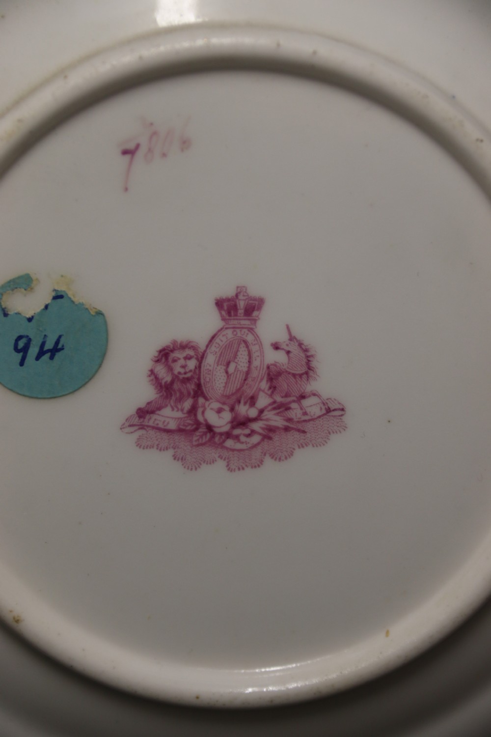 An early nineteenth-century Davenport porcelain cabinet trio comprising a teacup, coffee cup, and matching saucer decorated with hand-painted botanical flowers and gilded scrolling borders. View V