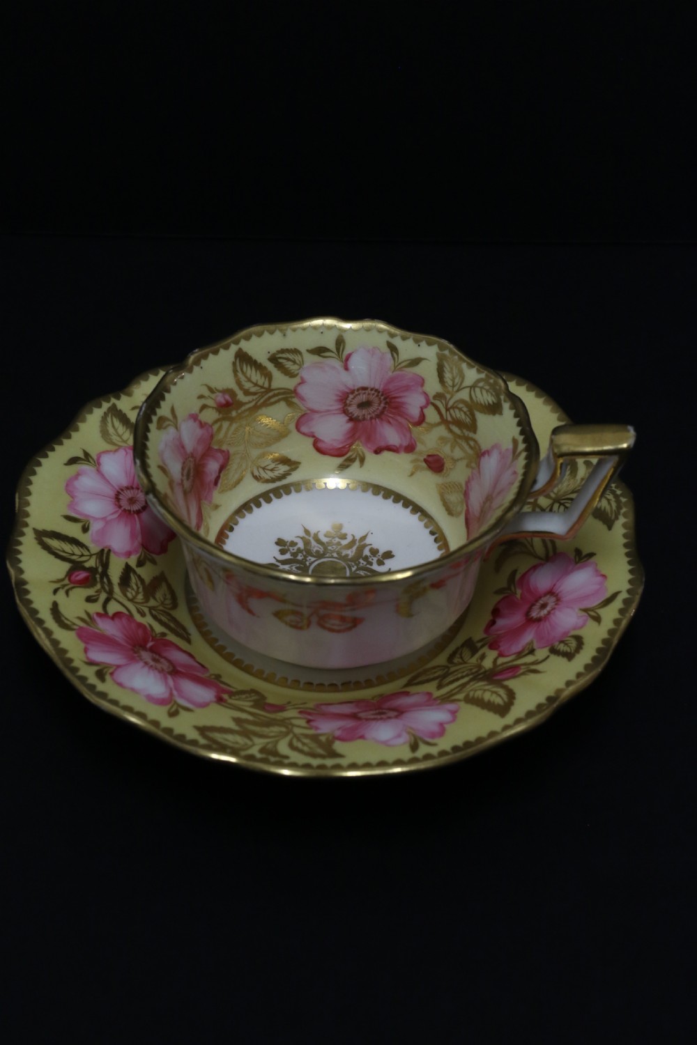 A beautifully painted early 19th c porcelain cabinet cup and saucer View V