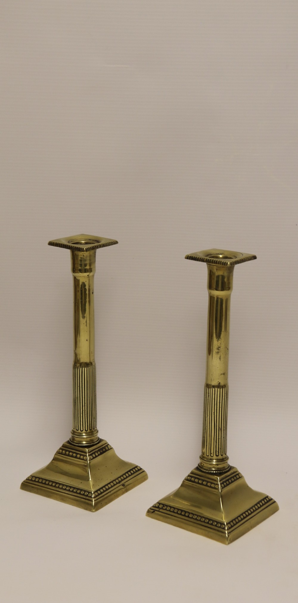 A good pair of English George III brass candlesticks.