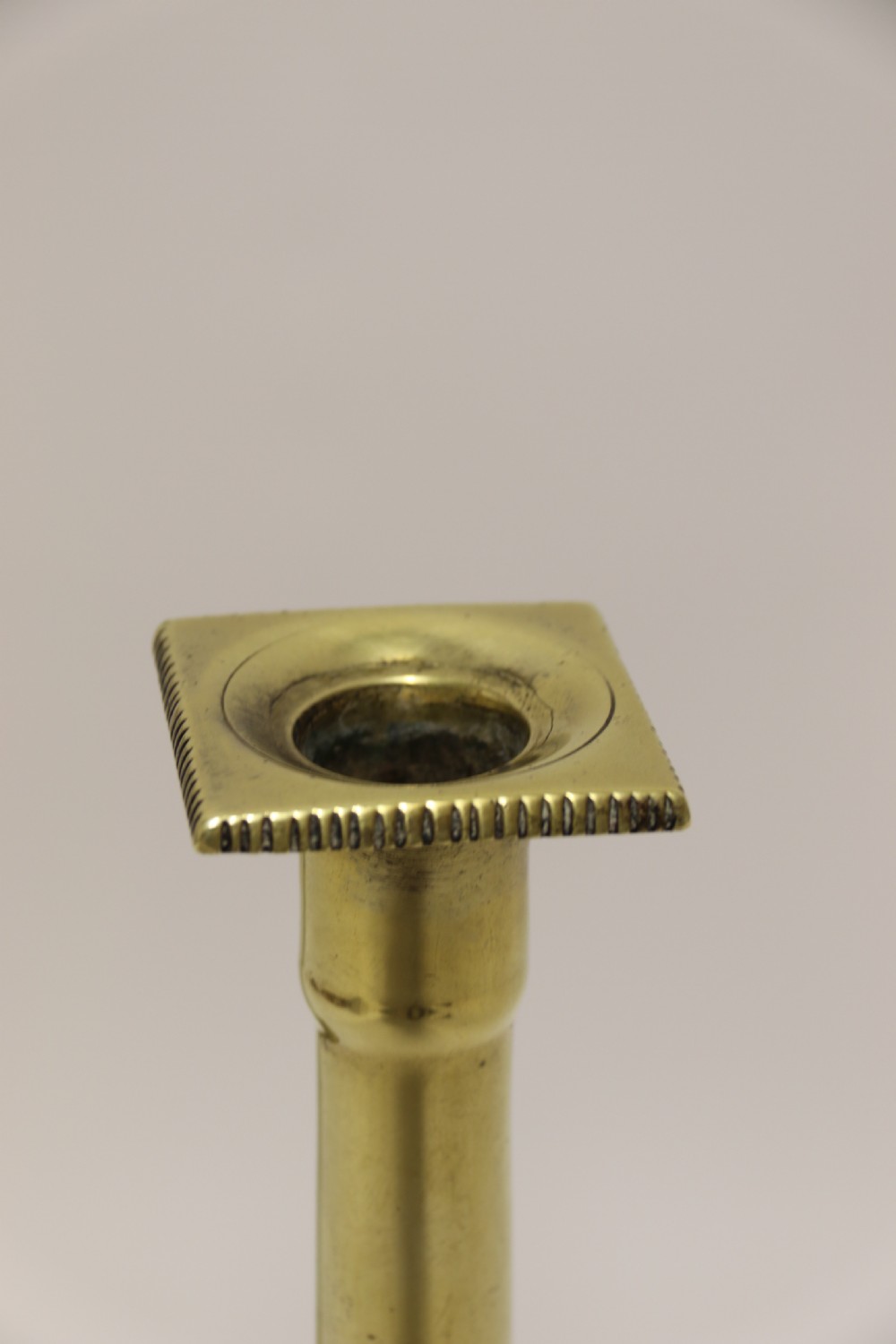 A good pair of English George III brass candlesticks. View VII