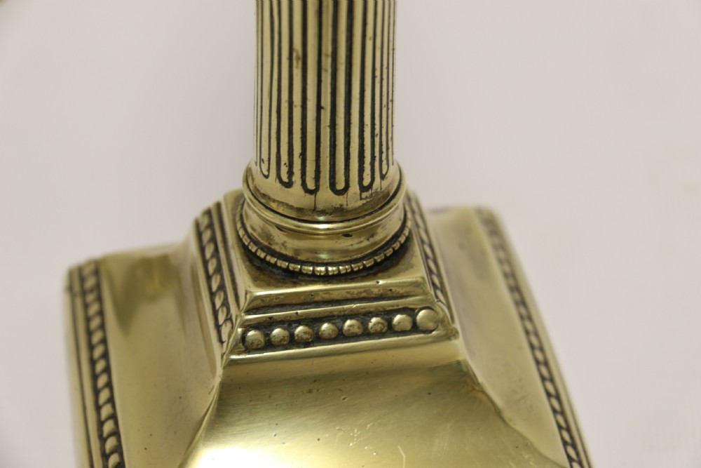A good pair of English George III brass candlesticks. View VIII
