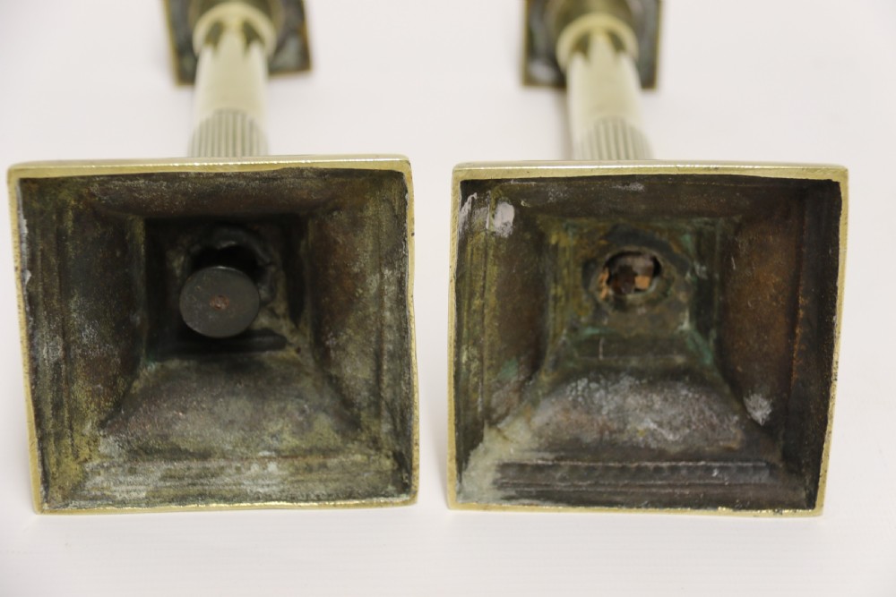 A good pair of English George III brass candlesticks. View IX