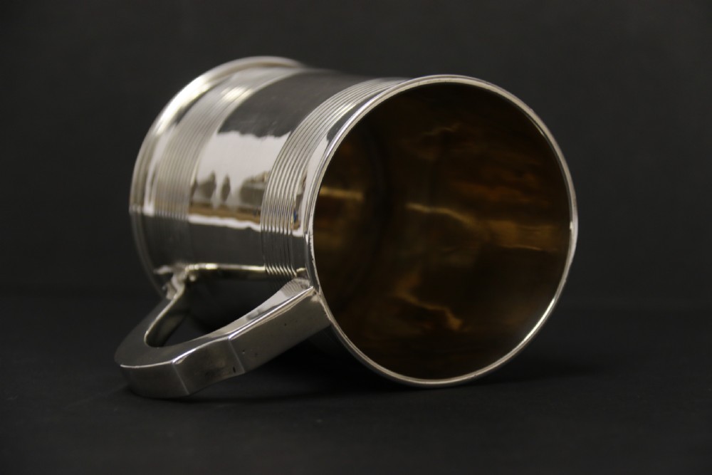 A heavy solid silver pint tankard London 1922-3 View XII