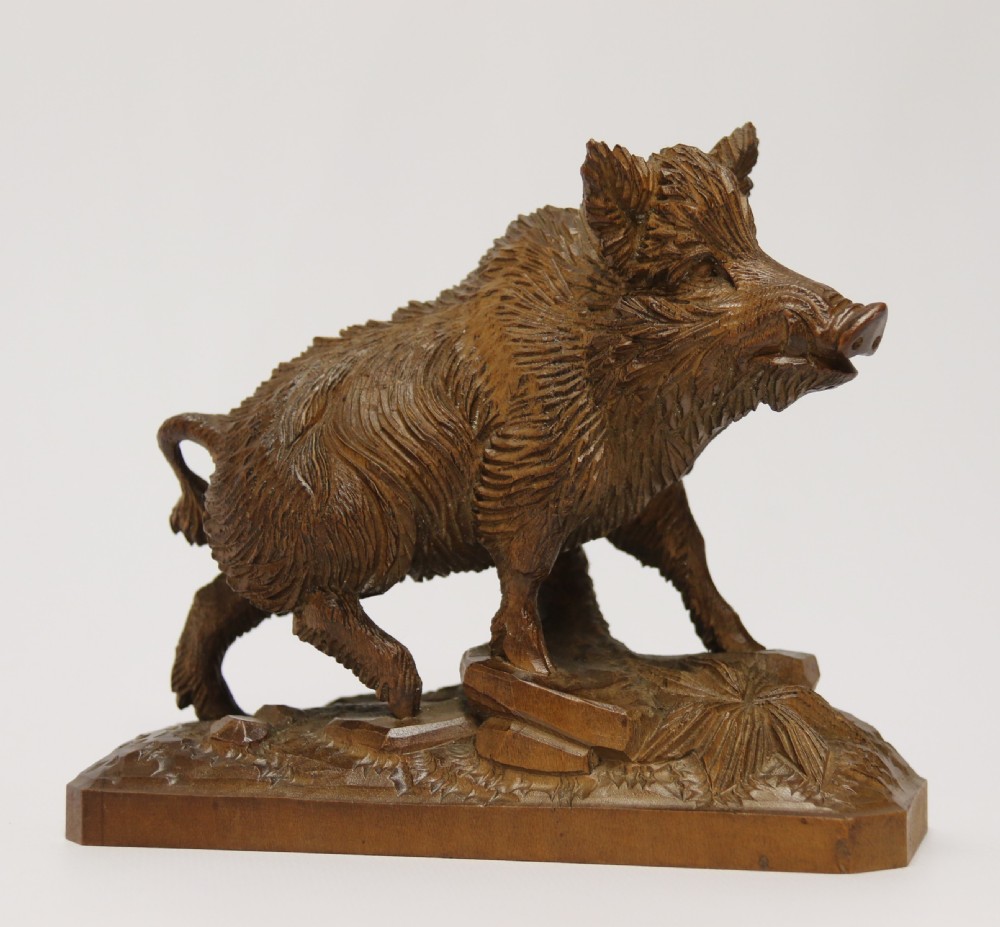 A fine Black Forest limewood carved study of a boar.