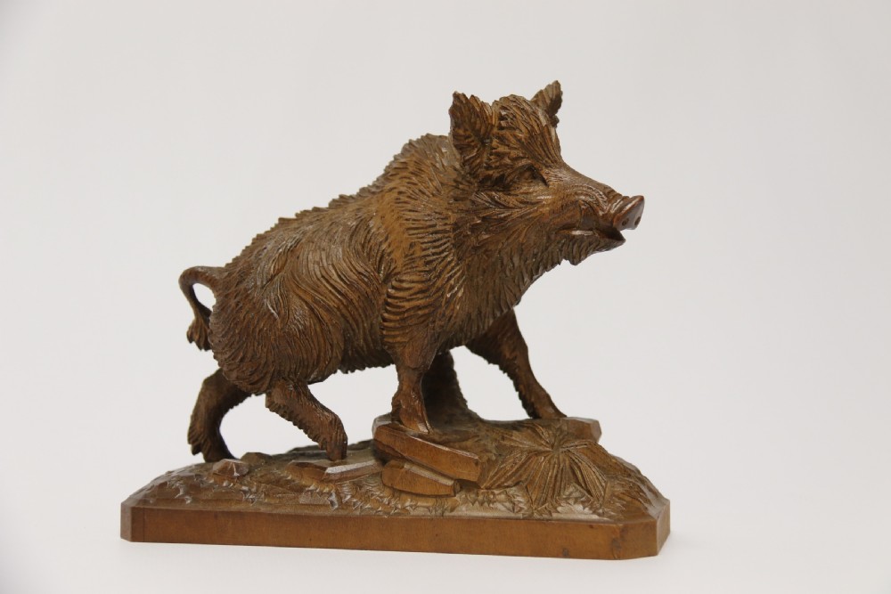 A fine Black Forest limewood carved study of a boar. View II